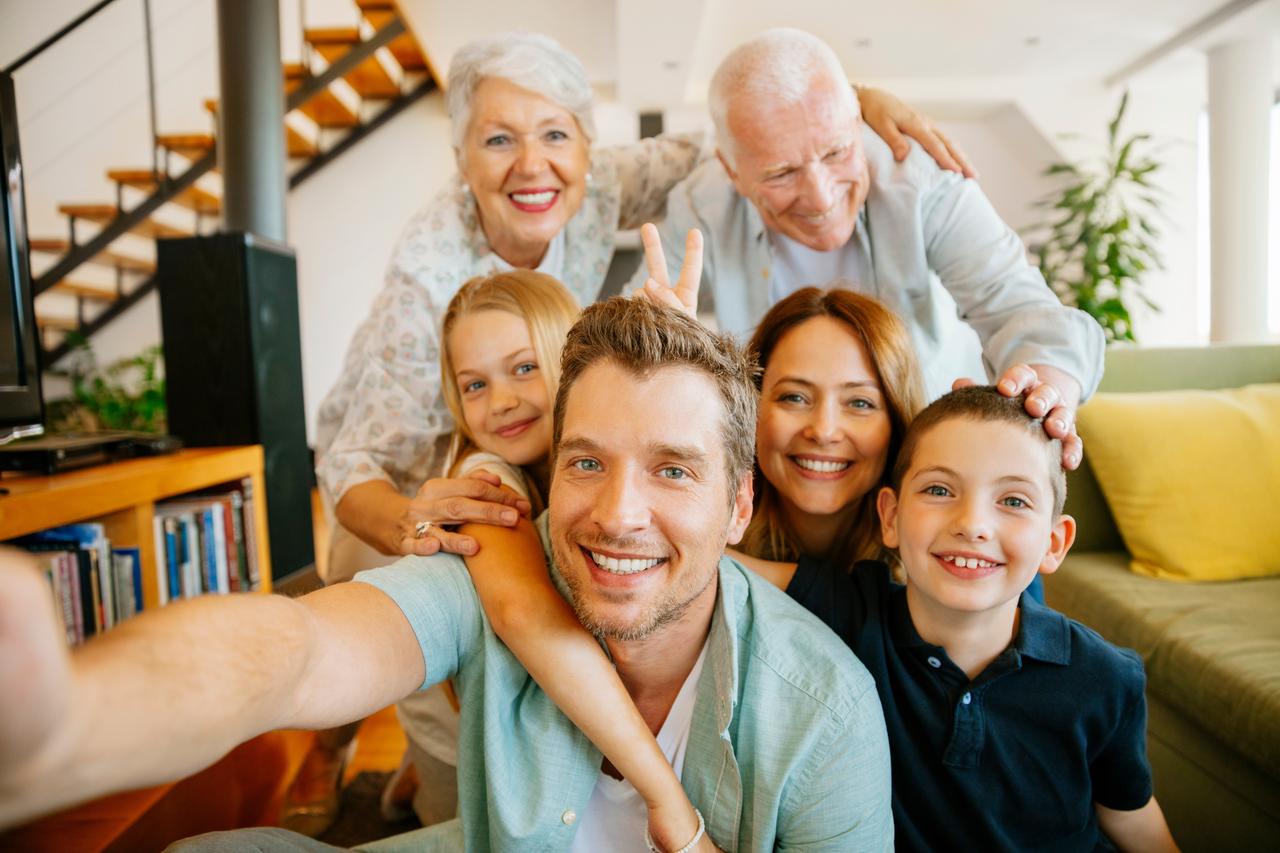 A multigenerational family captures a moment together. (Adobe Stock Photo)