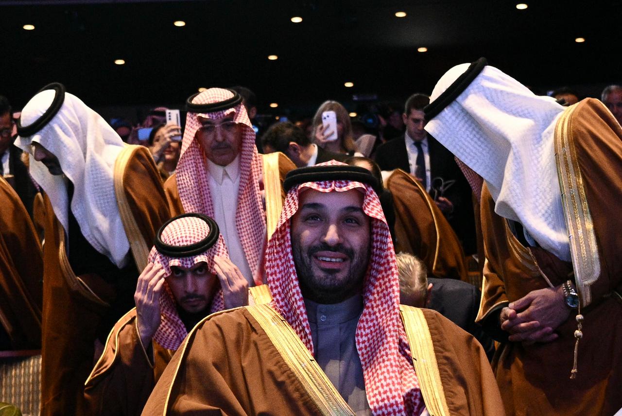 Mohammed bin Salman and members of the Saudi Arabia delegation listen as US President Donald Trump speaks during the US-Saudi Investment Forum at the John F. Kennedy Center for the Performing Arts in Washington, DC, on November 19, 2025. (AFP Photo)