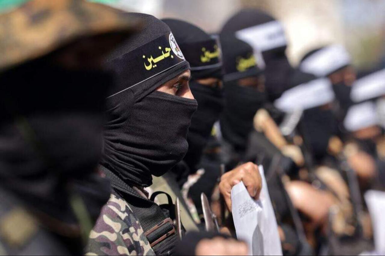 Armed Hamas movement militants take part in a rally to denounce the killing of Palestinians by the Israeli army in West Bank and to support Palestinians in Israeli jails, in Beit Lahia in the northern of Gaza Strip, on March 10, 2023. (AFP Photo)