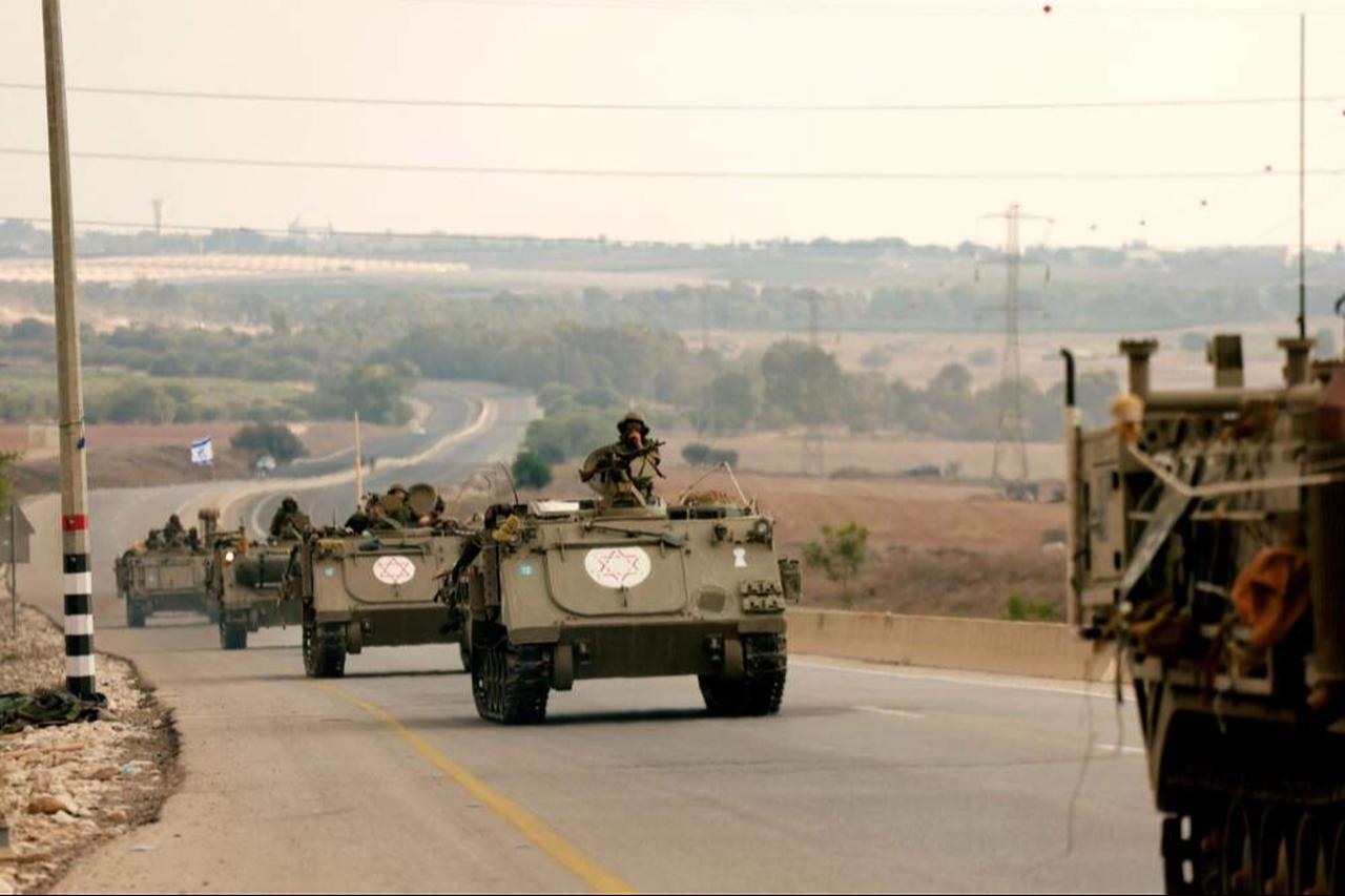 Israeli soliders ride in their armoured vehicles towards the border with the Gaza Strip, Gaza on Oct. 16, 2023. (AFP Photo)