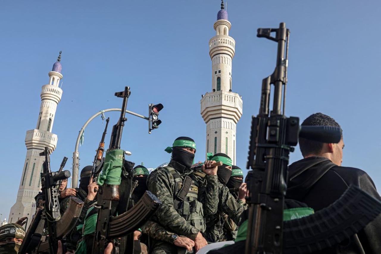 Members of the Ezzedine al-Qassam Brigades, the armed wing of the Palestinian Hamas movement, attend the funeral of their comrade Mohammed Abed during his funeral in Rafah in the southern Gaza Strip on Feb. 16, 2022. (AFP Photo)