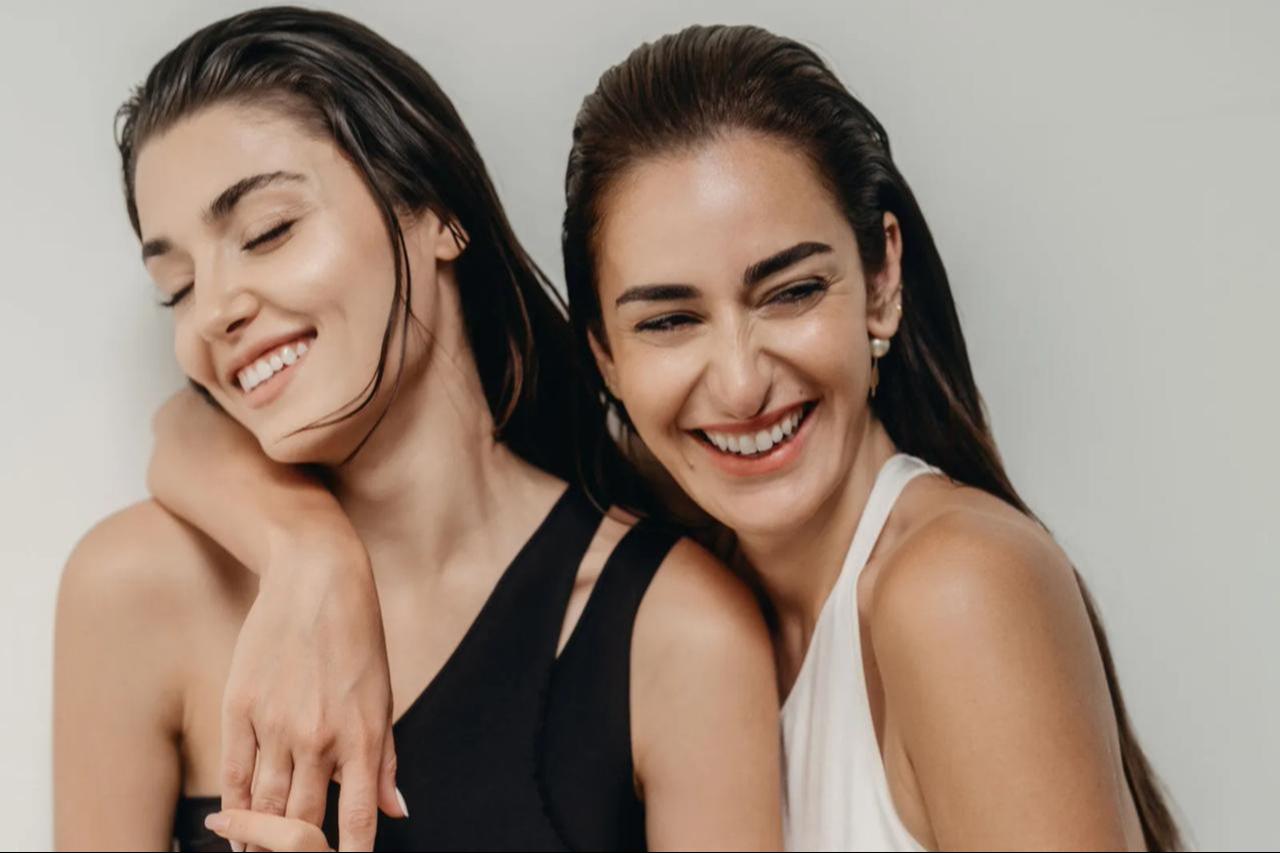 Turkish actress Hande Erçel (L) and Egyptian actress Amina Khalil (R) grace the Vogue Arabia cover in celebration of Unity, July 8, 2025. (Photo from Vogue Arabia)