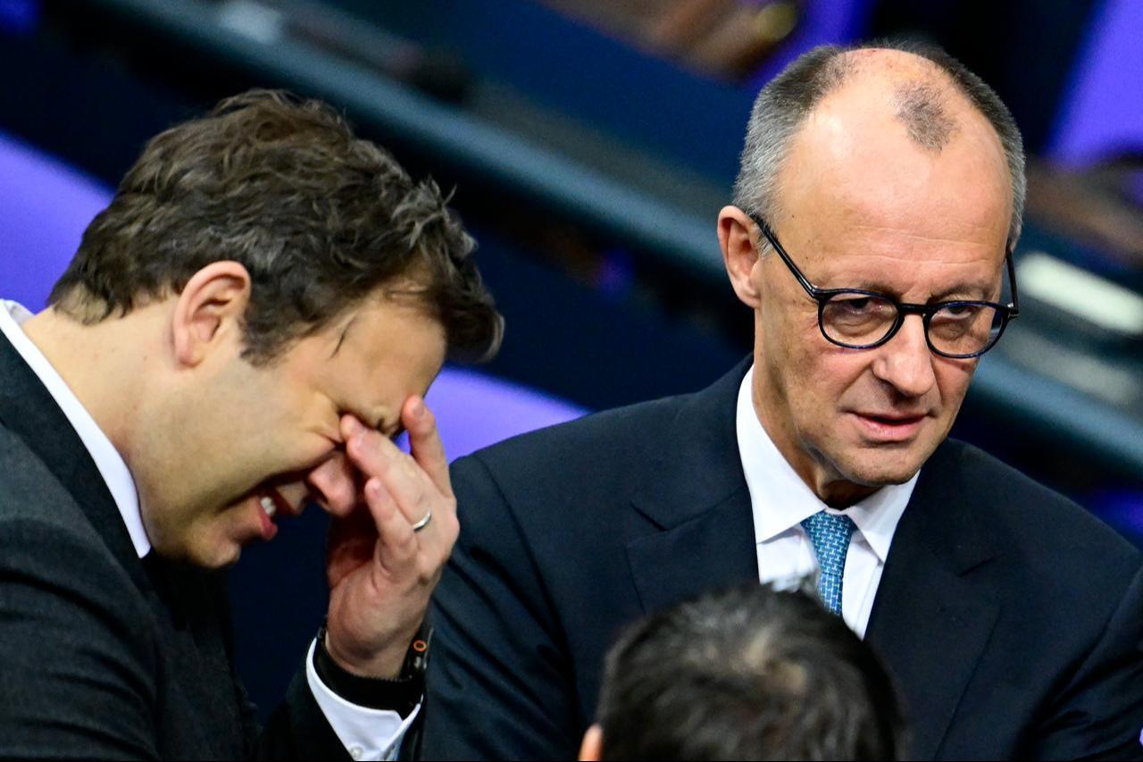German Chancellor Friedrich Merz (R) and German Finance Minister and Vice Chancellor Lars Klingbeil (L) are seen prior to a general debate on the budget of the Federal Chancellery at the Bundestag, Germany's lower house of parliament in Berlin, November 26, 2025. (AFP Photo)