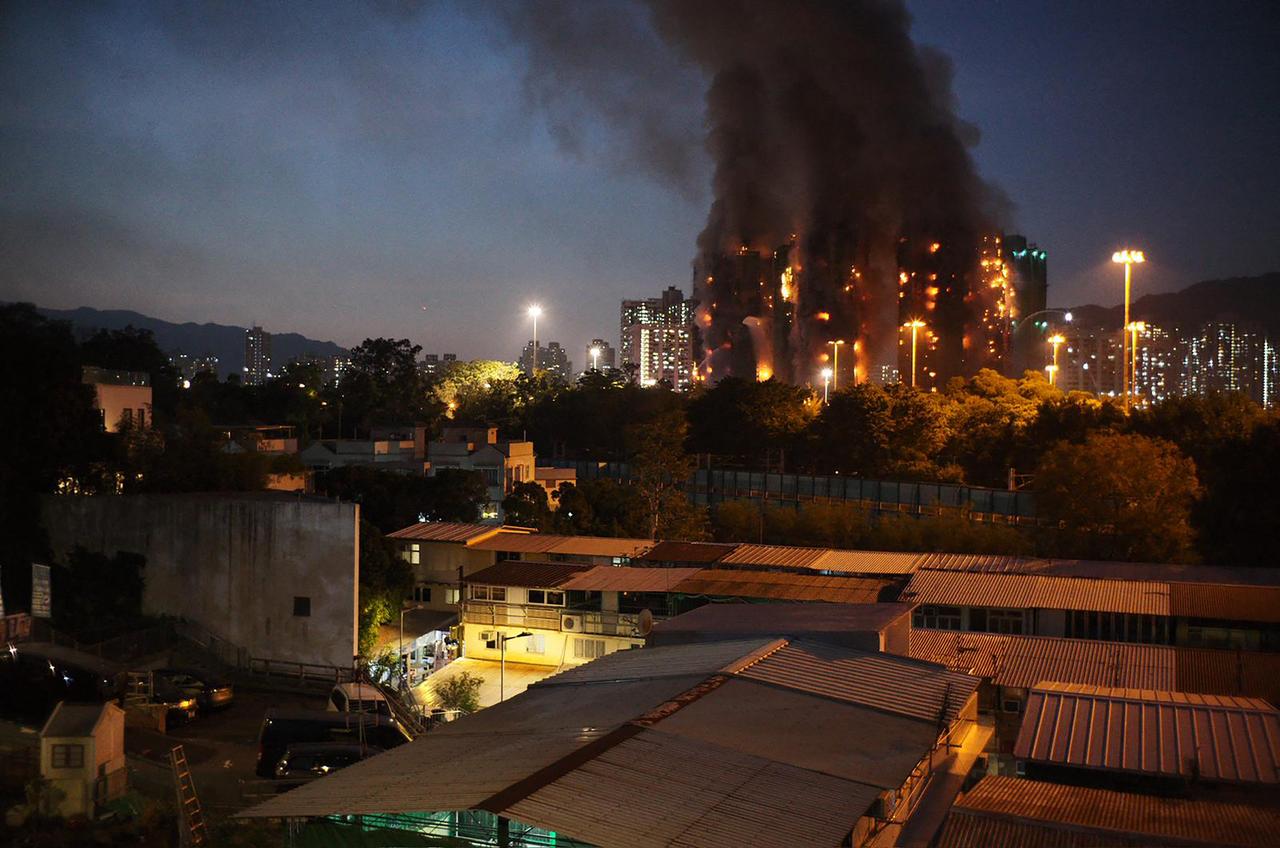 Thick smoke and flames rise as a major fire engulfs several apartment blocks at the Wang Fuk Court residential estate in Hong Kong's Tai Po district on Nov. 26, 2025. (AFP Photo)