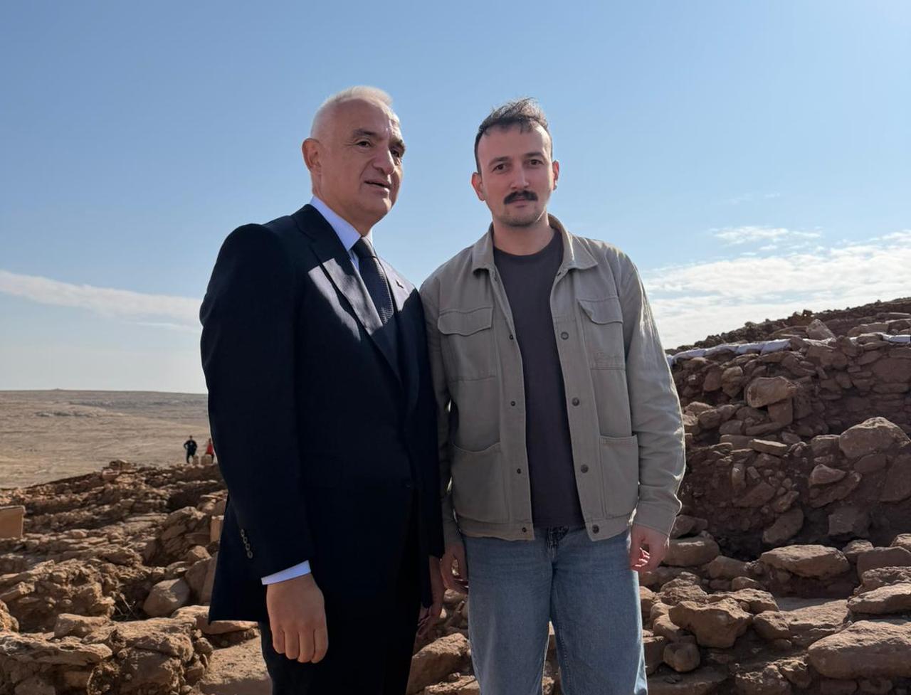 Culture and Tourism Minister Mehmet Nuri Ersoy visits the Karahantepe excavation site during the Tas Tepeler 5th-year programme, pictured here with journalist Koray Erdogan. (Photo by Türkiye Today team)