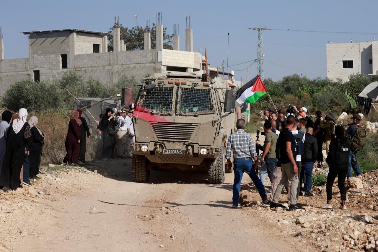 Residents of the Nur Shams refugee camp and foreign solidarity activists gather at the entrance of the camp during a protest demanding the right to return to their homes, near Tulkarem in the Israeli-occupied West Bank, November 23, 2025. (AFP Photo)