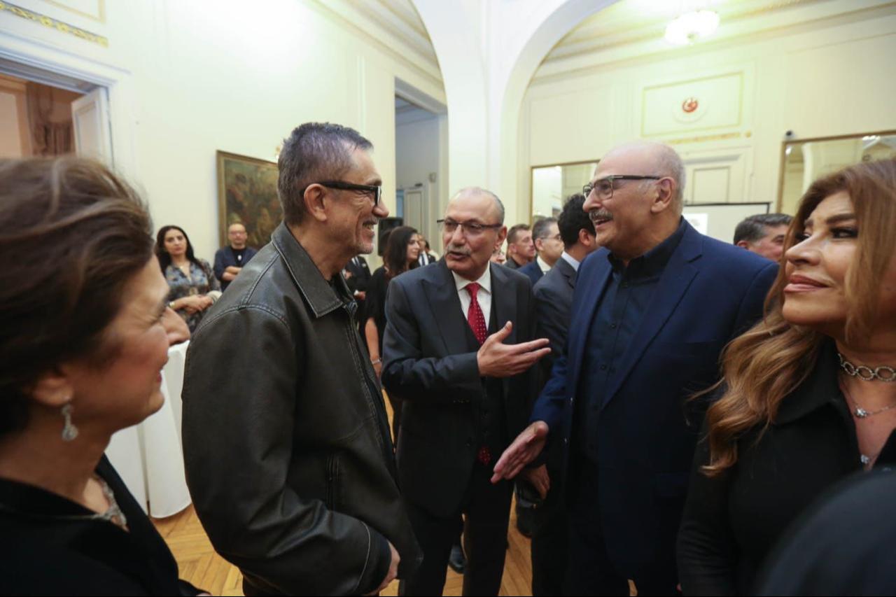 Turkish Ambassador to Cairo Salih Mutlu Sen and filmmaker Nuri Bilge Ceylan speak with Syrian actor Gamal Suliyman during a reception at the Turkish Embassy in Cairo held in honor of the Turkish delegation participating in the 46th Cairo International Film Festival on November 16, 2025. (AA Photo)