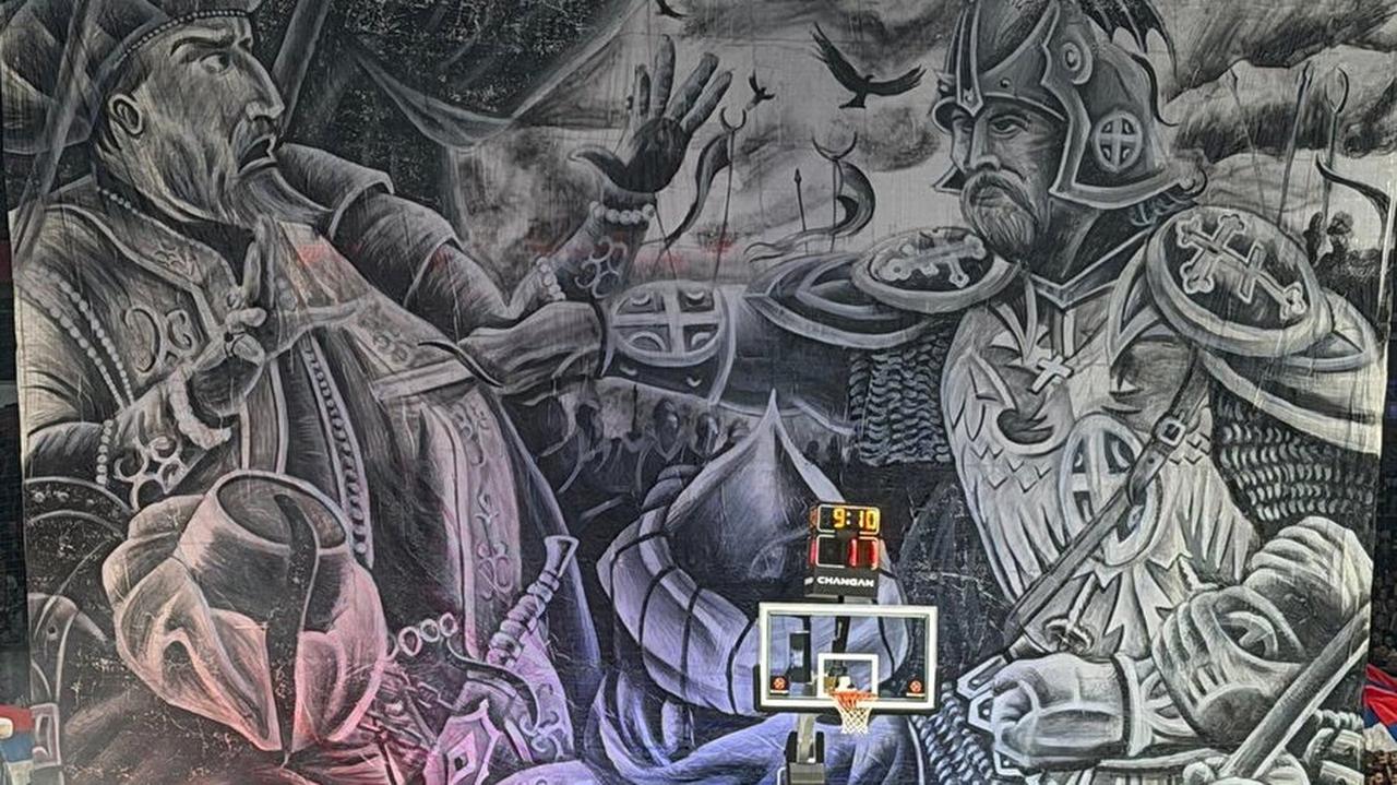 A large banner showing Milos Obilic confronting Ottoman Sultan Murad I hangs in the stands during the Partizan–Fenerbahce Beko game in Belgrade, drawing widespread criticism for its racist and provocative imagery. (Photo via Hurriyet)