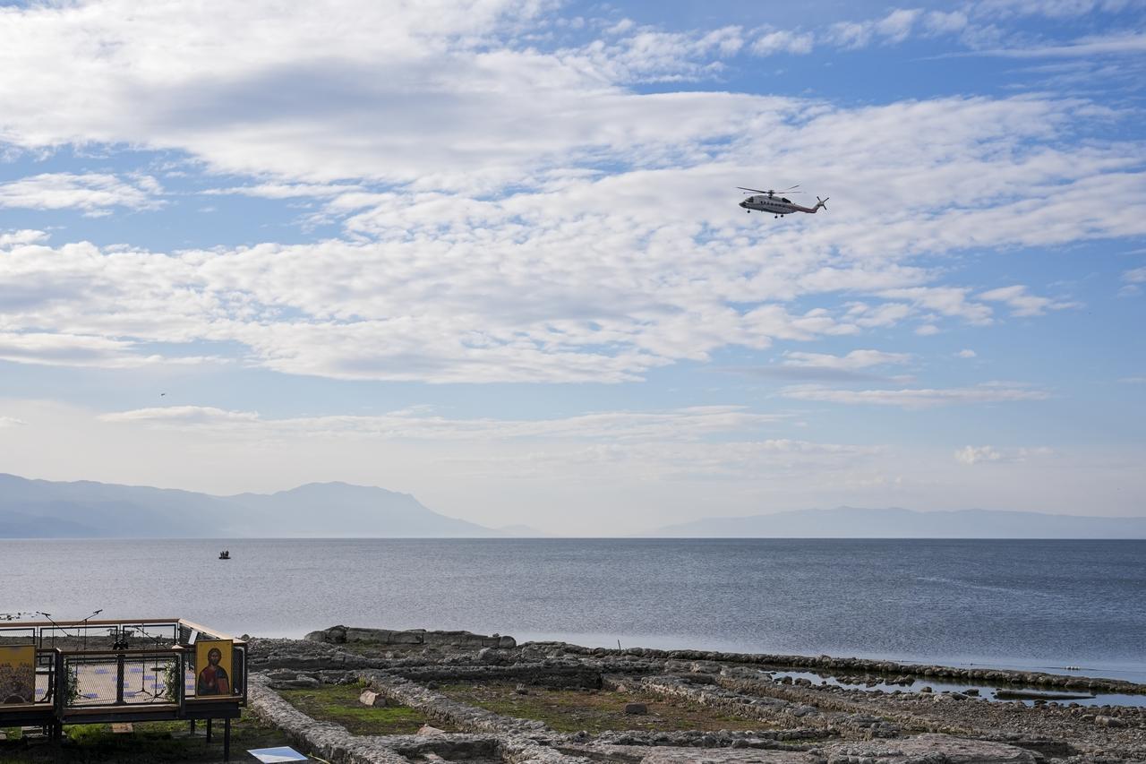 A helicopter carrying Pope Leo XIV tours over the ruins of submerged basilica, revealed in 2014 after water levels receded in Lake Iznik and identified as having been built in honor of Saint Neophytos in Bursa, Türkiye on Nov. 28, 2025. (AA Photo)