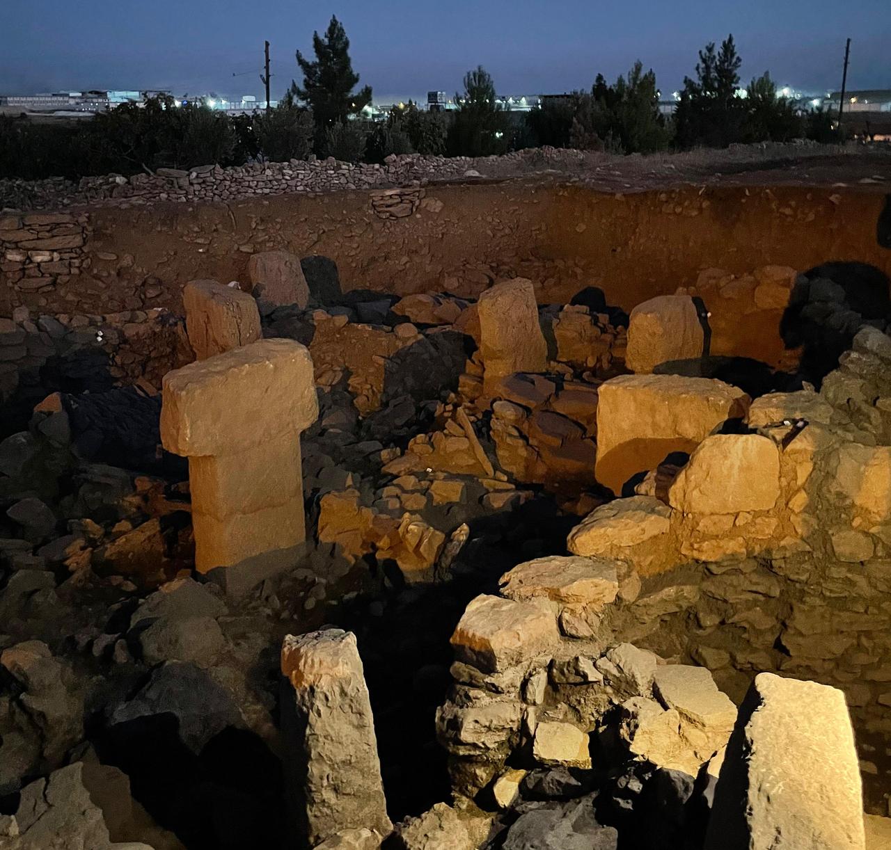 Night view of the Neolithic public structure excavated at Sayburc, illuminated to reveal T-shaped pillars and stone walls that indicate ceremonial or communal use. (Photo by Koray Erdogan/Türkiye Today)