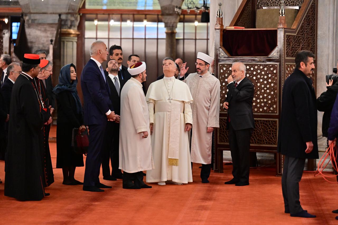 Pope Leo XIV, accompanied by the Turkish Minister of Culture and Tourism Mehmet Nuri Ersoy and the mosque officials, visits the Sultanahmet Mosque in Istanbul, Türkiye on Nov. 29, 2025. (AA Photo)