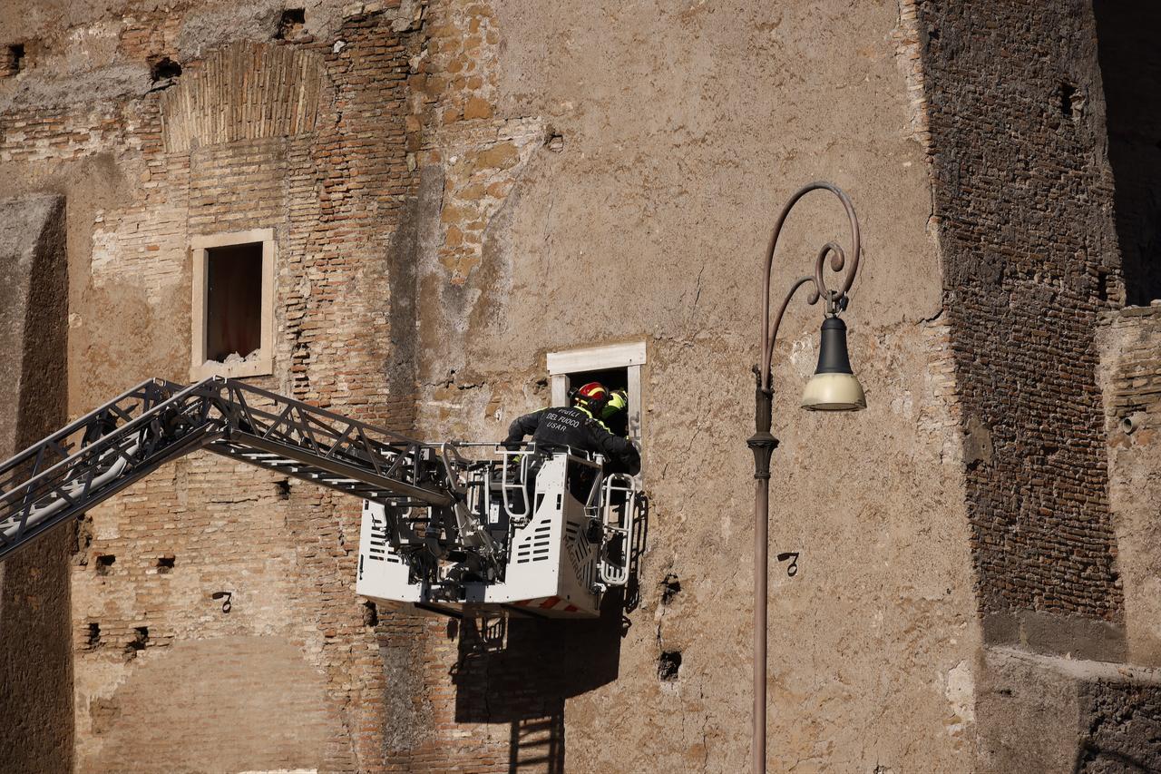 Emergency teams use a ladder truck to access the upper floors of the partially collapsed medieval tower during rescue operations. (AA Photo)