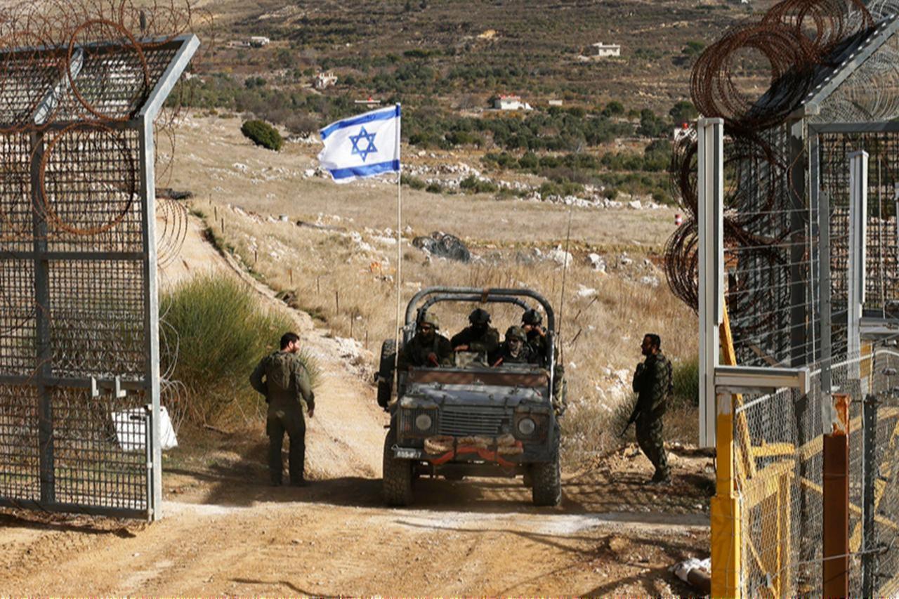 An Israeli military vehicle crosses the fence as they return from buffer zone with Syria, near Druze village of Majdal Shams in Israel-annexed Golan Heights, Dec. 10, 2024. (AFP Photo)