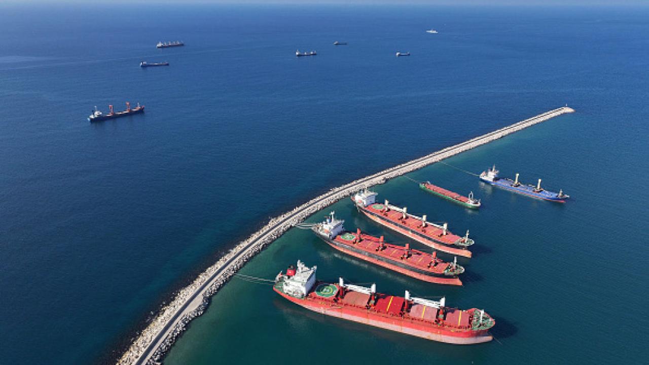 File photo shows an aerial view of Syria's Tartus Port, where multiple cargo ships are docked alongside the breakwater, accessed on January 24, 2025. (AFP Photo)