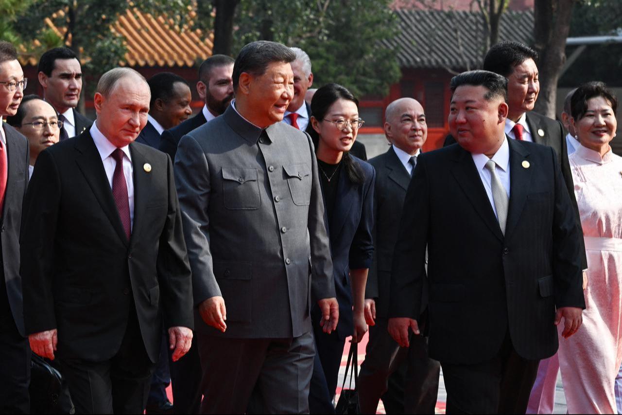In this pool photograph distributed by the Russian state agency Sputnik, (L-R) Russias President Vladimir Putin walks with Chinas President Xi Jinping and North Koreas leader Kim Jong Un before a military parade marking the 80th anniversary of victory over Japan and the end of World War II, in Beijing’s Tiananmen Square, China, on Sept. 3, 2025. (AFP Photo)