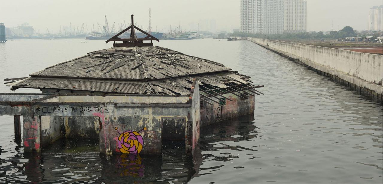 The Waladuna mosque in Jakarta, Indonesia, was well above water in the 1980s─since then, however, rising water and sinking land means the building has been overtaken. (Photo via Pacific Imagica)