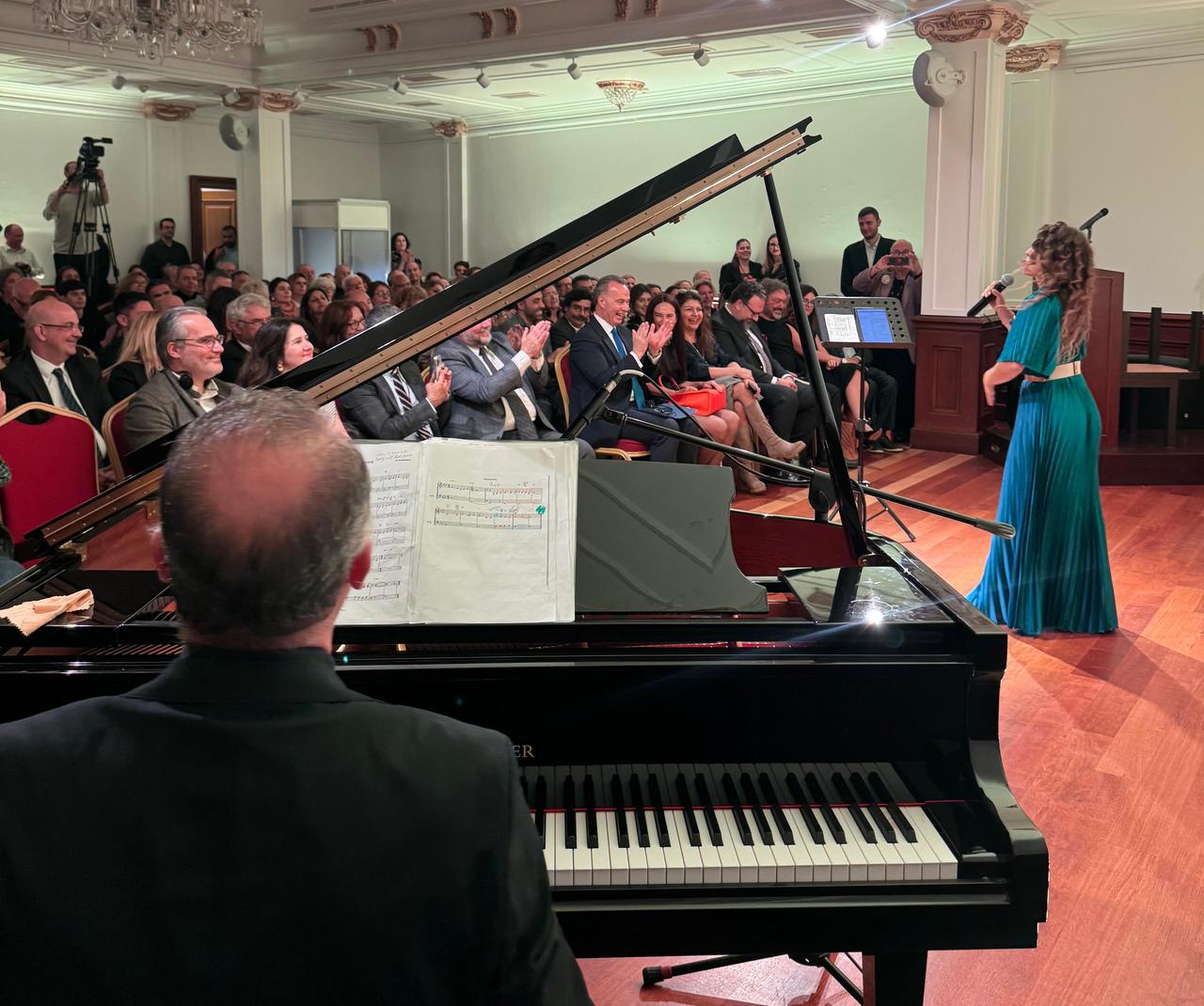 Greek vocalist Betty Harlafti performs works by Mikis Theodorakis, accompanied on piano by Turkish pianist Ali Koc, before a full audience in Istanbul, Türkiye, Nov. 5, 2025. (Photo via Press Office of the Consulate General of Greece in Istanbul)