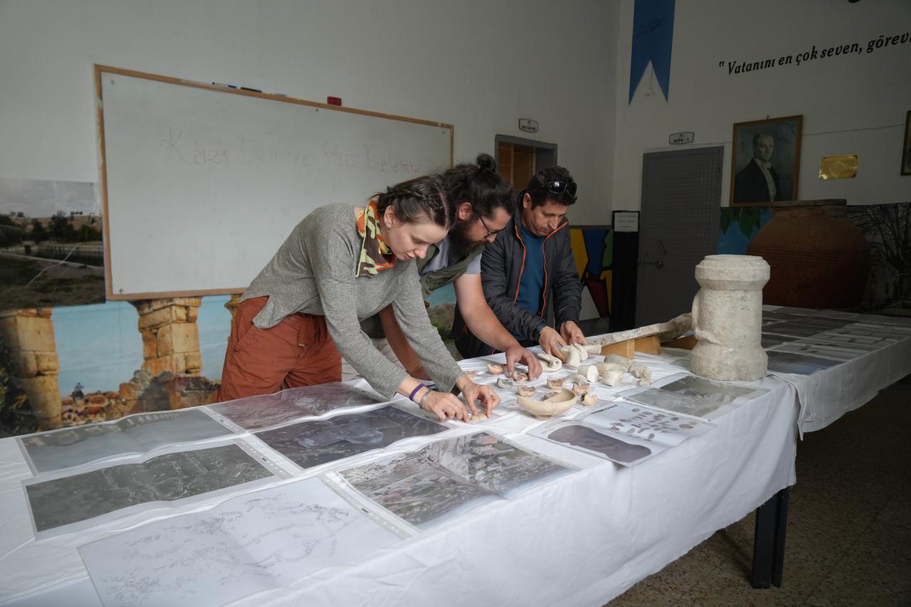 Members of the excavation team examining and documenting artifacts recovered from the Roman Pool site, Nov. 7, 2025. (IHA Photo)