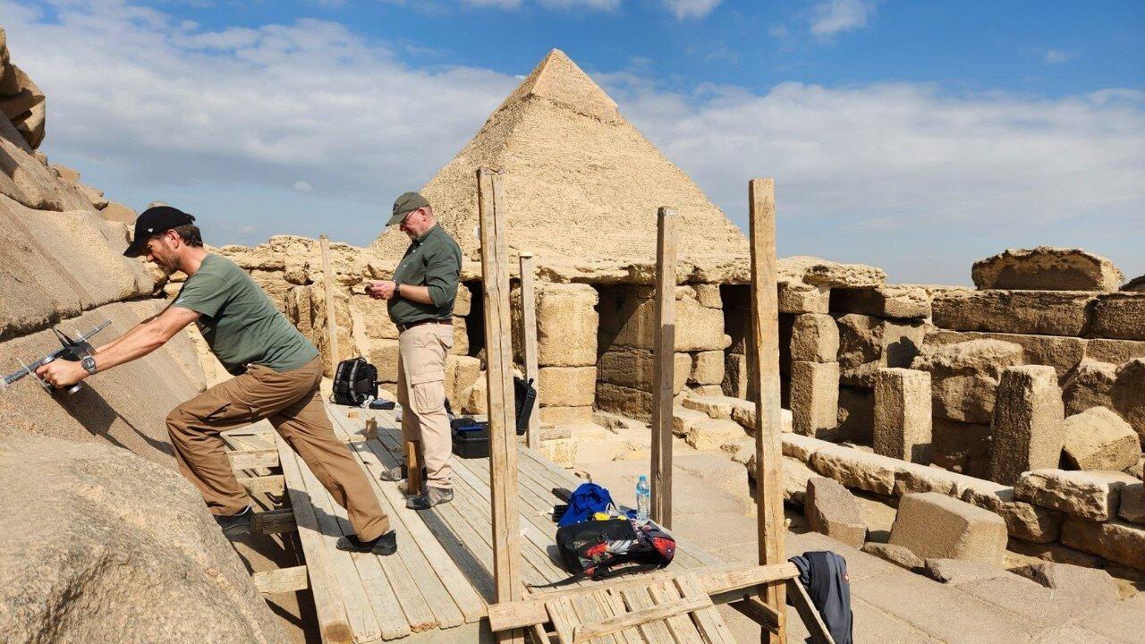 Researchers conducting non-destructive testing on the eastern façade of the Menkaure Pyramid. (Photo via ScanPyramids Project/Cairo University & Technical University of Munich)