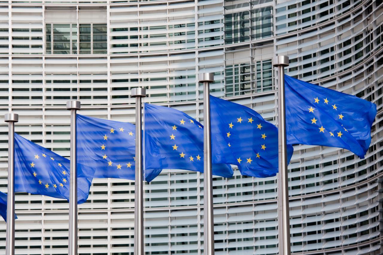 A line of EU flags stands in front of the European Commission building in Brussels, accessed on Nov. 9, 2025. (Adobe Stock Photo)