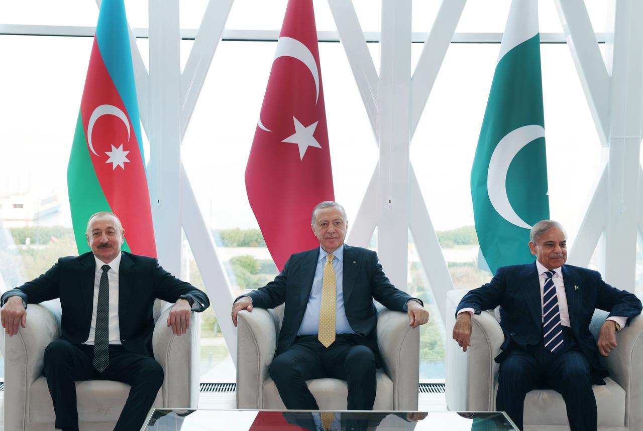 Turkish President Recep Tayyip Erdogan (C) meets with Azerbaijani President Ilham Aliyev (L) and Pakistani Prime Minister Shehbaz Sharif (R) as part of the Azerbaijan's Victory Day Ceremony in Baku, Azerbaijan. on November 8, 2025. (Turkish Presidency / AA Photo)