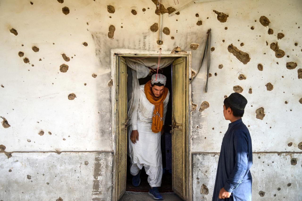 An Afghan man inspects a damaged house, following cross-border fire from Pakistan's artillery shelling, at a village in the Spin Boldak district of Kandahar on November 7, 2025. (AFP Photo)