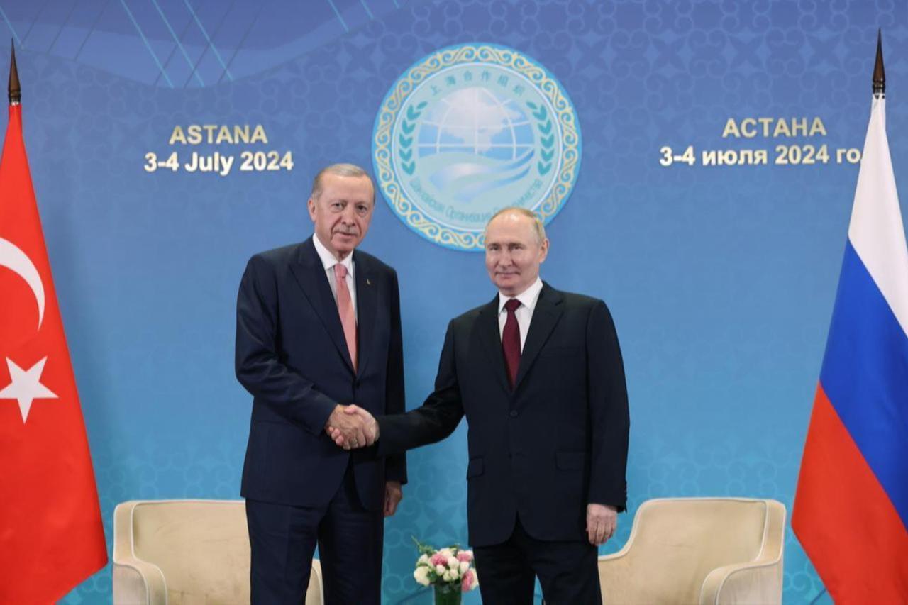 President Erdogan (L) shakes hands with Russian President Putin (R) within the scope of his contacts at the 24th Shanghai Cooperation Organization Summit in Astana, Kazakhstan, July 3, 2024. (AA Photo)
