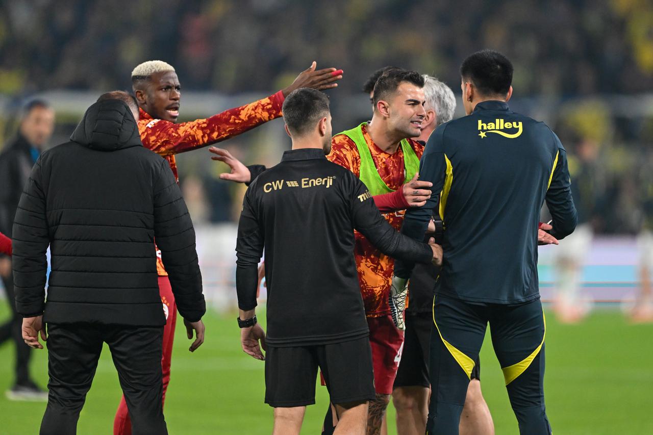 Fenerbahce and Galatasaray players clash during warmups before league showdown