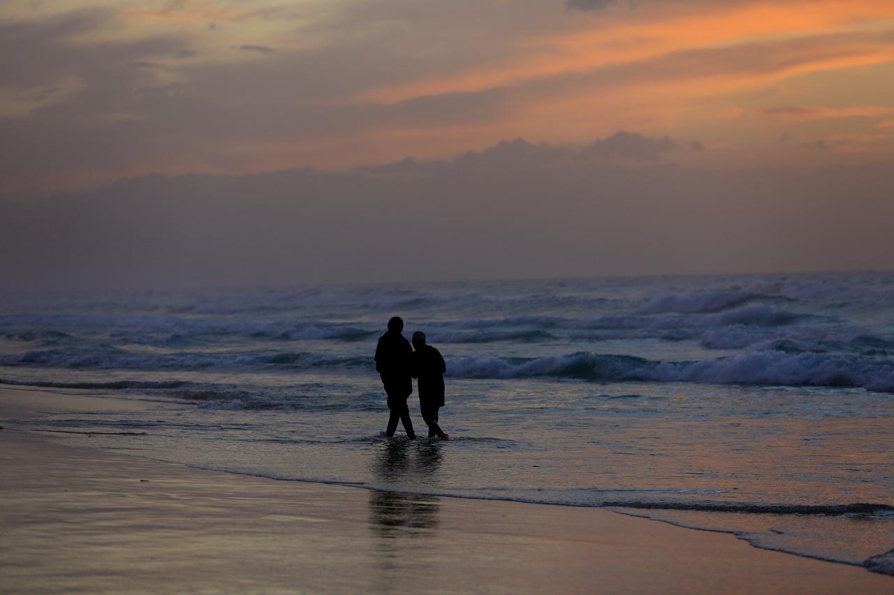 Palestinians spend time around Gaza Port as Palestinians continue to struggle to survive under difficult conditions, Dec. 8, 2025. (AA Photo)