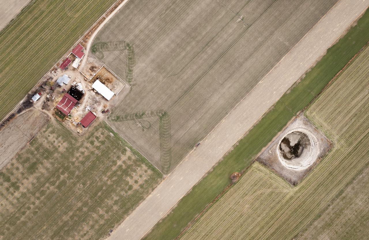 An aerial view of Yarimoglu sinkhole which formed in 2009 in a field near the Karapinar-Konya highway, stands out with its large diameter and depth in Konya, Türkiye, Dec. 5, 2025. (AA Photo)