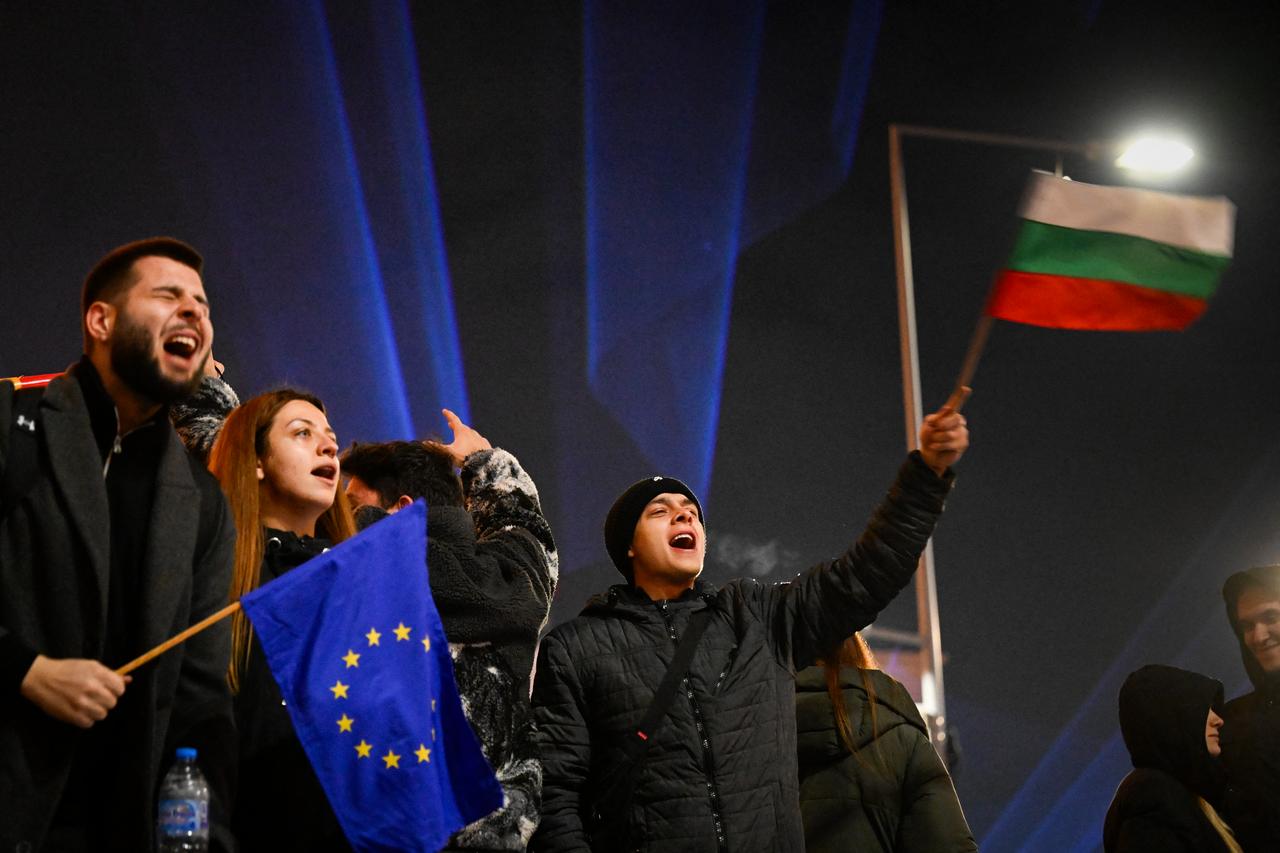 Protesters wave Bulgarian and EU flags during an anti-government demonstration in Sofia on Dec. 10, 2025. (AFP Photo)