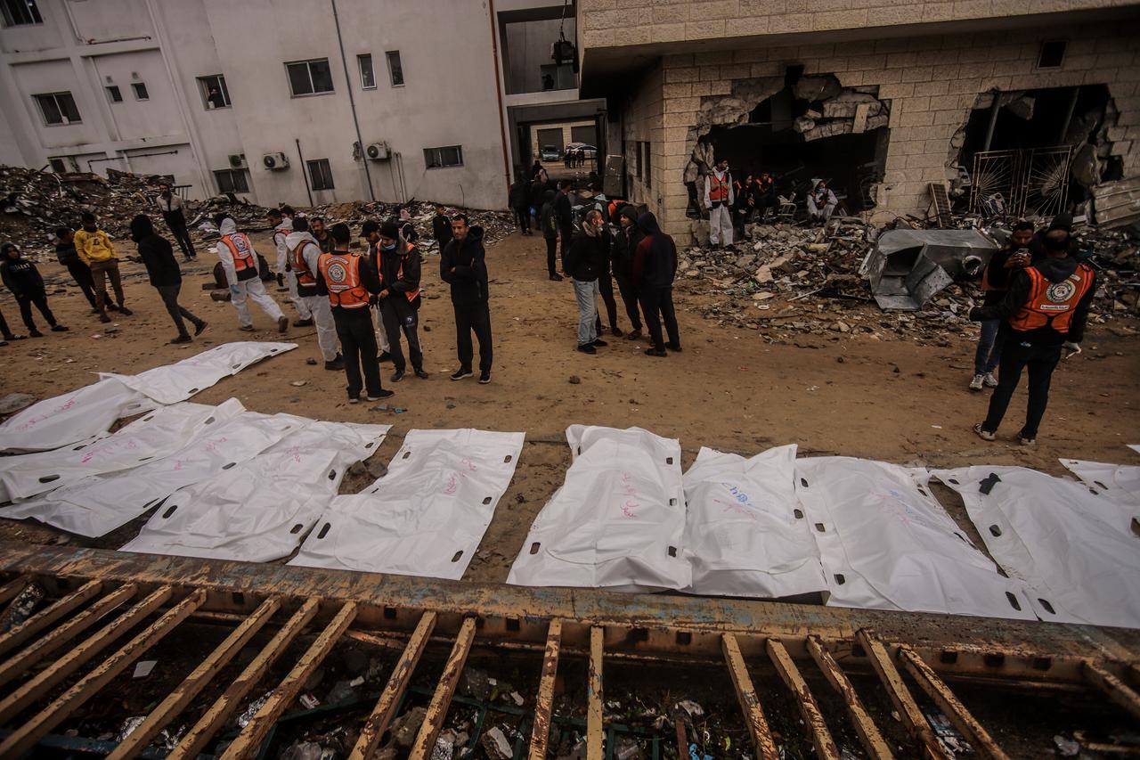 Efforts are ongoing to exhume the bodies of Palestinians who were forced to be buried in the courtyard of Al-Shifa Hospital in Gaza City, in the northern Gaza Strip, on December 11, 2025. (AA Photo)