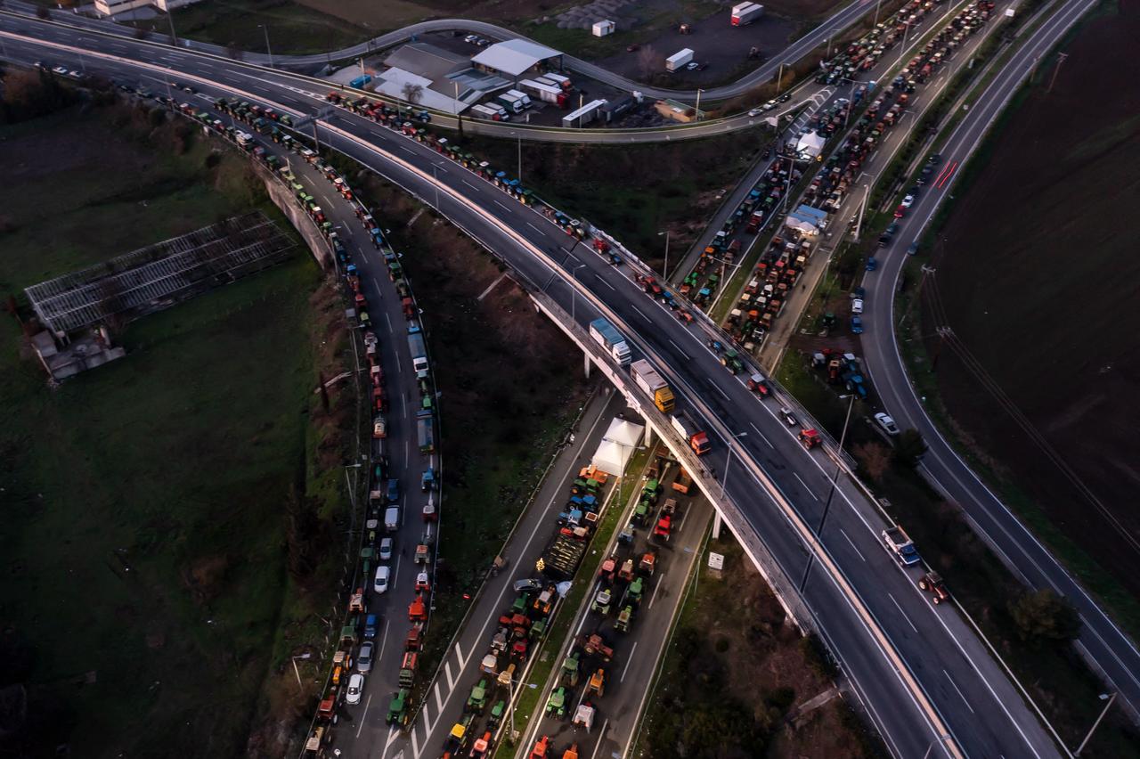 An aerial view shows farmers' tractors blocking a national highway outside Larissa, Greece, December 9, 2025. (AFP Photo)