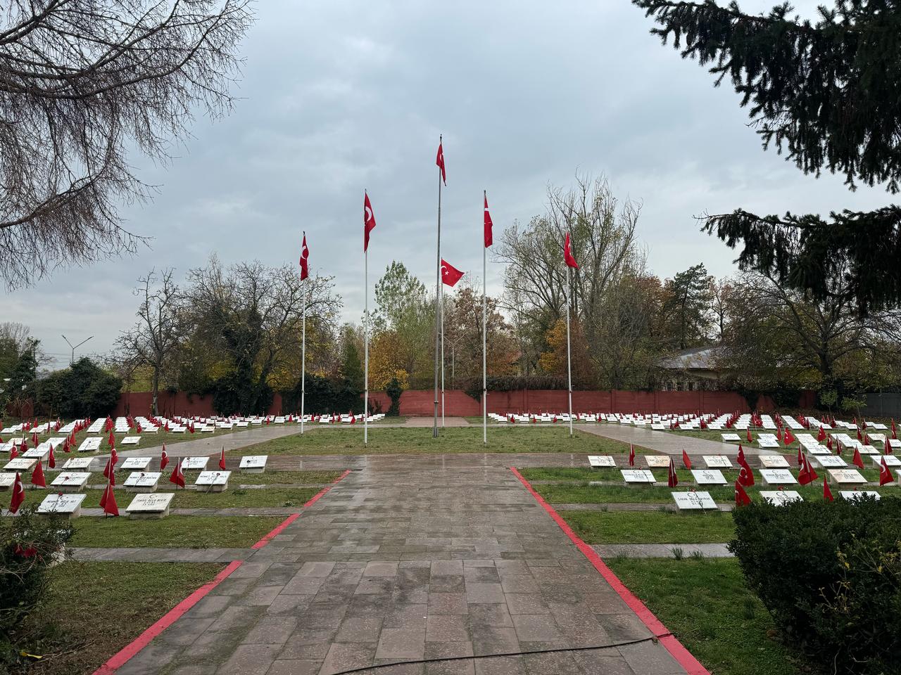 A general view shows the central walkway and flagpoles overlooking the Turkish Martyrs’ Cemetery in Bucharest, Romania, Dec. 12, 2025. (AA Photo)