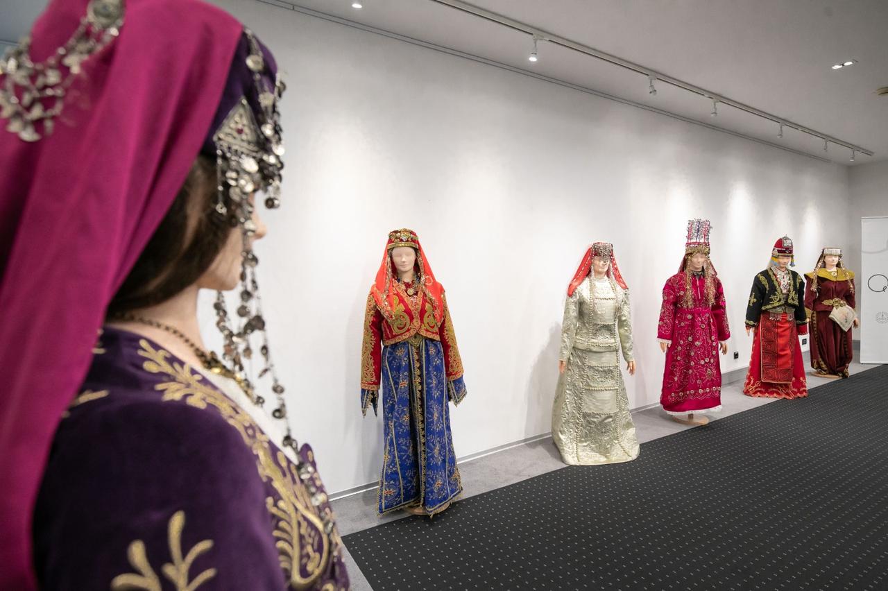 Mannequins wearing regional Anatolian bridal dresses line the gallery space during the exhibition at the Yunus Emre Institute in Zagreb, Croatia, Dec. 11, 2025. (AA Photo)