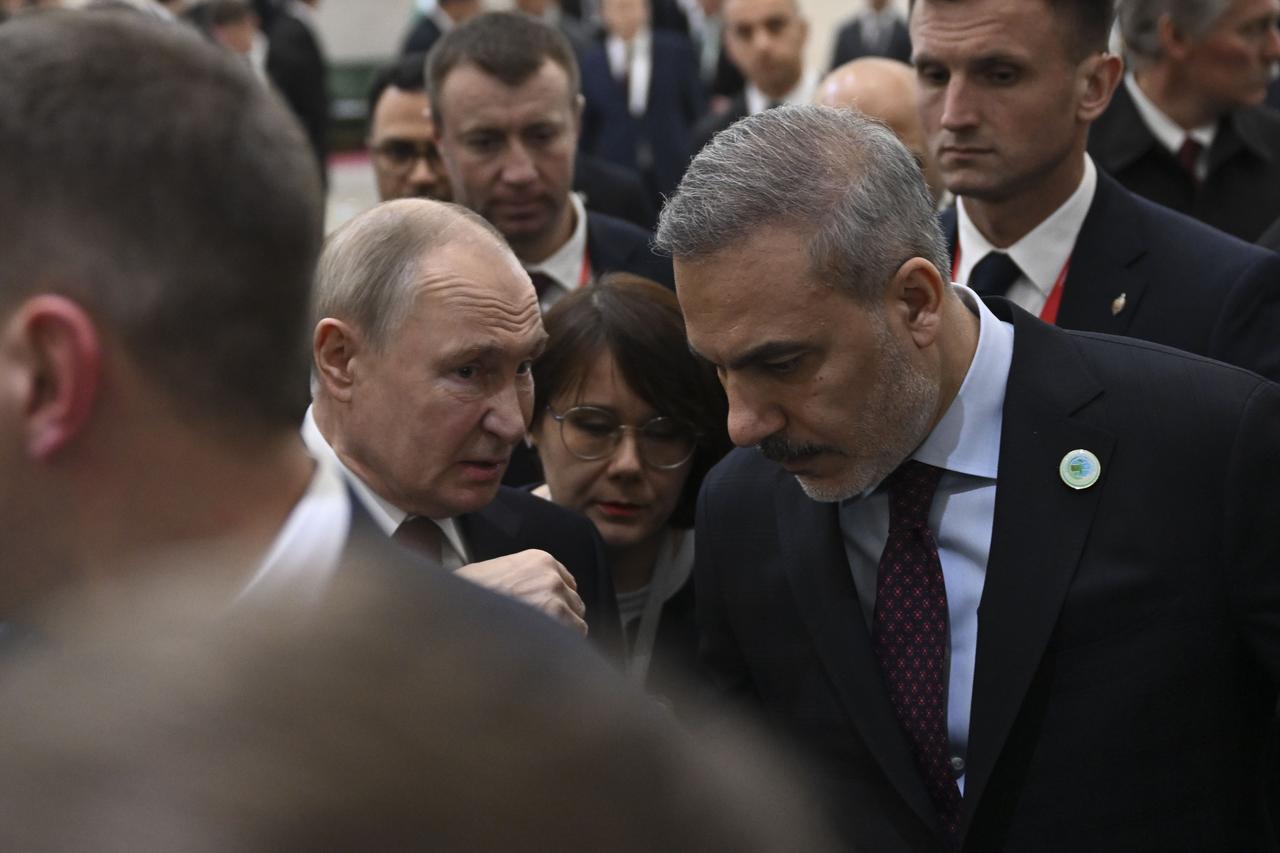 Turkish Foreign Minister Hakan Fidan meets with Russian President Vladimir Putin as part of the International Peace and Security Forum in Ashgabat, Turkmenistan on Dec. 12, 2025. (AA Photo)