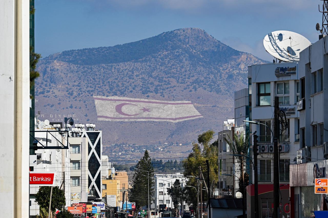 A view of a TRNC flag on the Besparmak Mountains ahead of the first round of the presidential election, where eight candidates will compete on Sunday in Lefkosia, Turkish Republic of Northern Cyprus on October 17, 2025. (AA Photo)