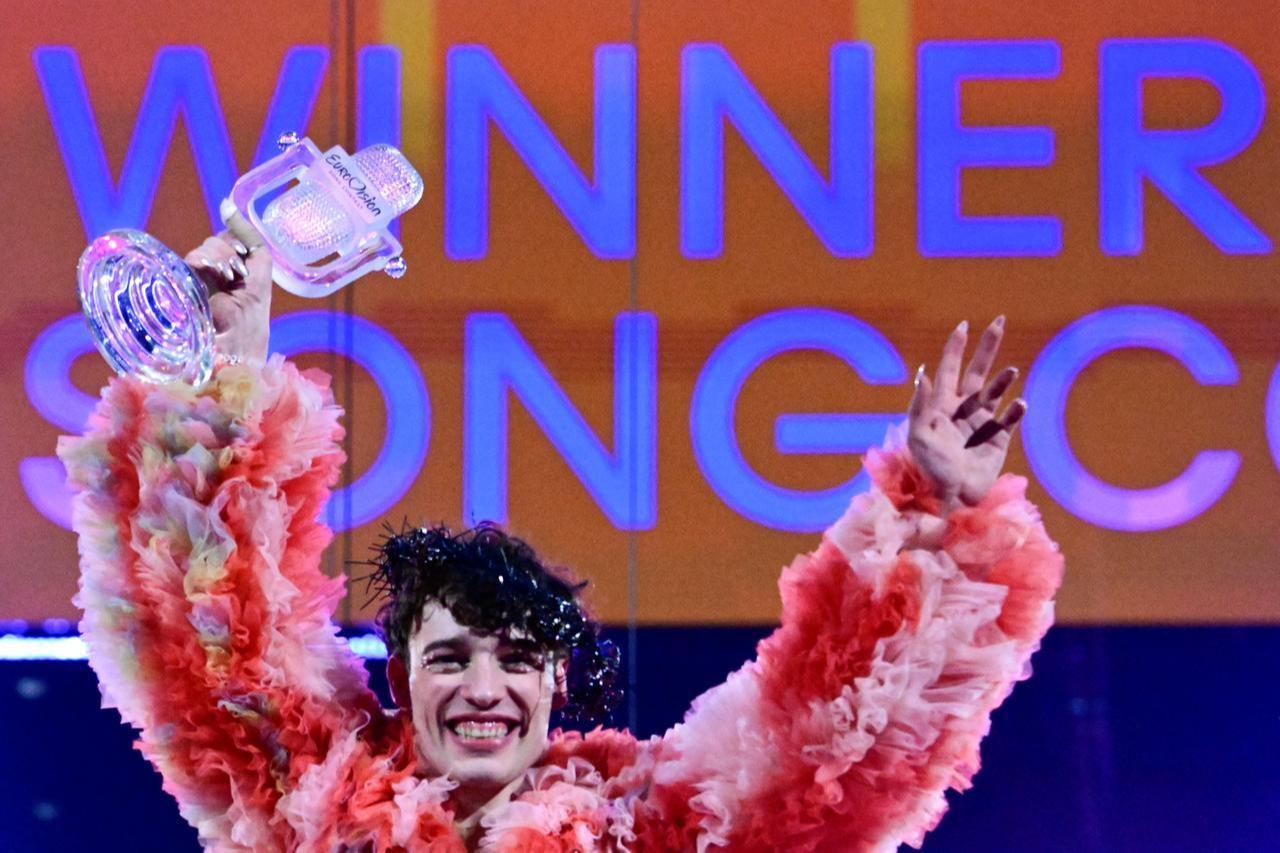 Swiss singer Nemo representing Switzerland with the song  The Code  celebrates on stage with his trophy after winning the final of the 68th Eurovision Song Contest (ESC) at the Malmo Arena in Malmo, Sweden on May 11, 2024. (AFP File Photo)