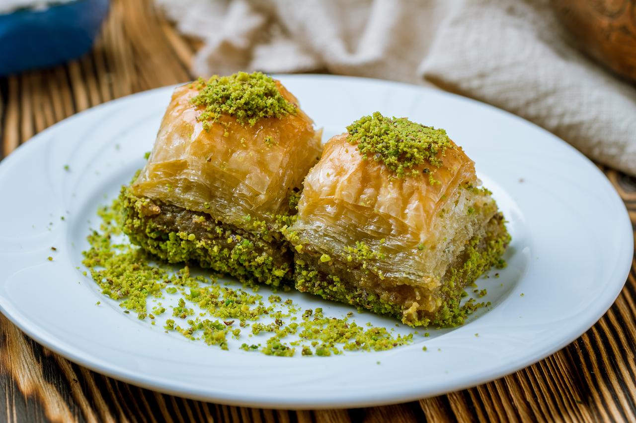 Baklava, one of Türkiye’s most iconic desserts, features delicate layers of hand-rolled filo pastry and pistachios. (Adobe Stock Photo)