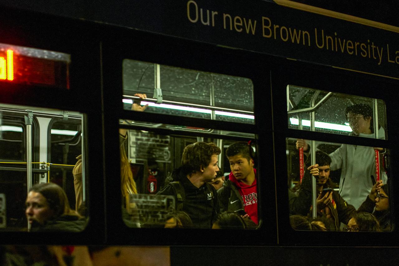 Brown University students are evacuated in a public bus after a mass shooting at the Barus & Holley building, home to the engineering and physics departments, in Providence, Rhode Island, on Dec. 13, 2025. (AFP Photo)