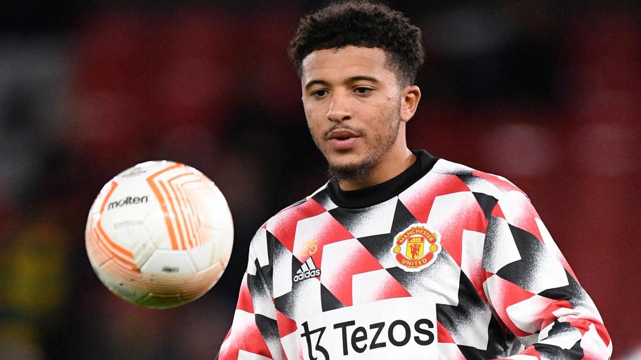 Jadon Sancho warms up during a pre-match session in a Manchester United kit at Old Trafford in Manchester, England. (AFP Photo)