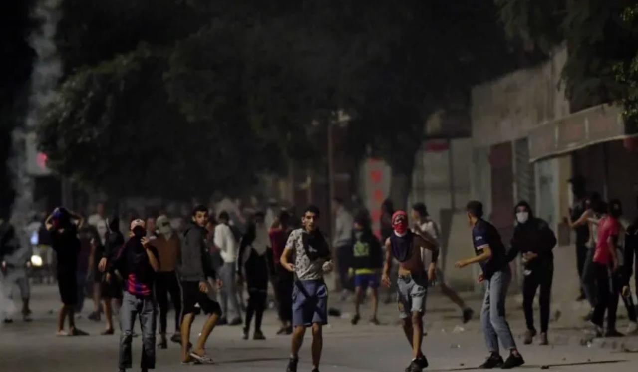 Previous protesters throw rocks at security forces in Ettadhamen, west of the capital Tunis, on Oct. 14, 2022. (AFP Photo)