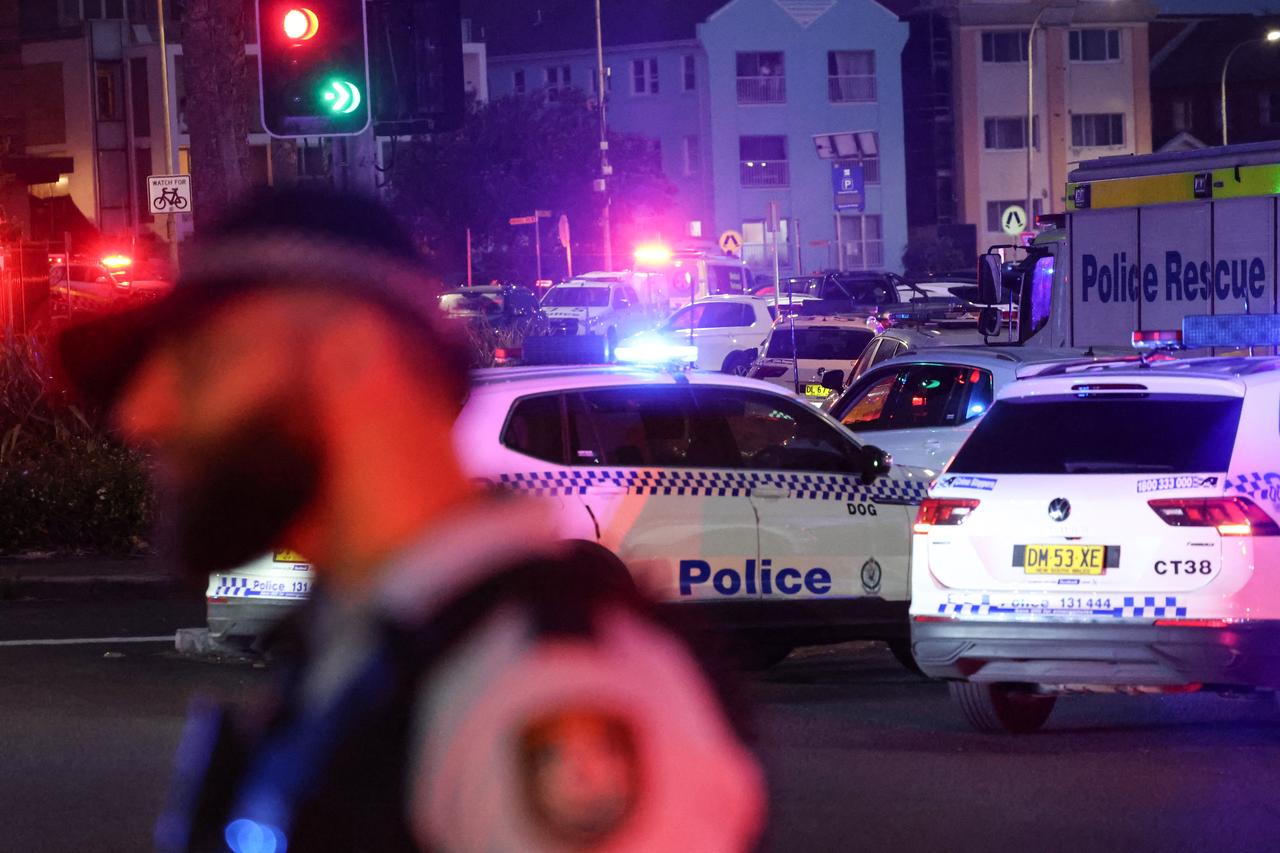 People vehicles are seen on a road after a shooting incident at Bondi Beach in Sydney on Dec. 14, 2025. (AFP Photo)
