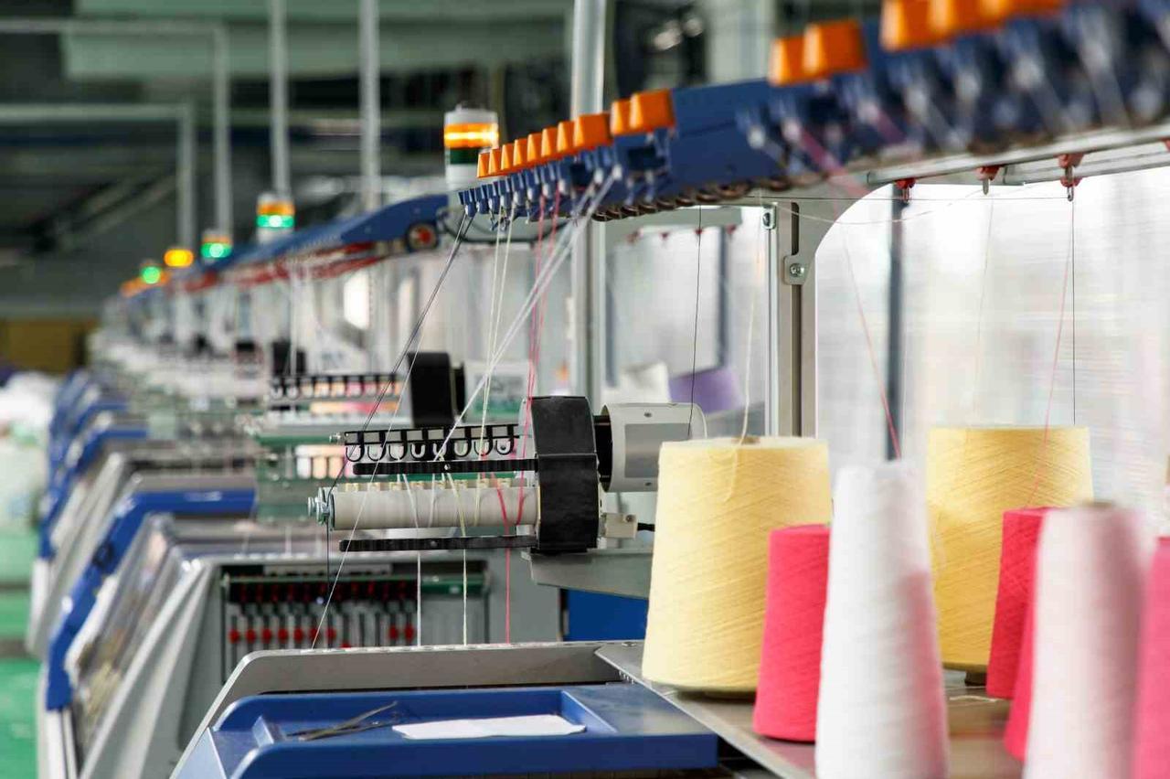 Automated machines spin and wind colored yarns in a modern textile production facility in Türkiye. (IHA Photo)