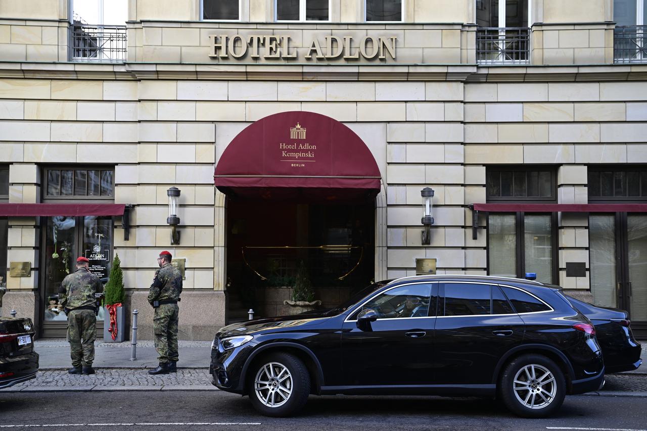 Members of the military police stand at the entrance of the hotel Adlon on December 14, 2025, in Berlin, Germany. (AFP Photo)