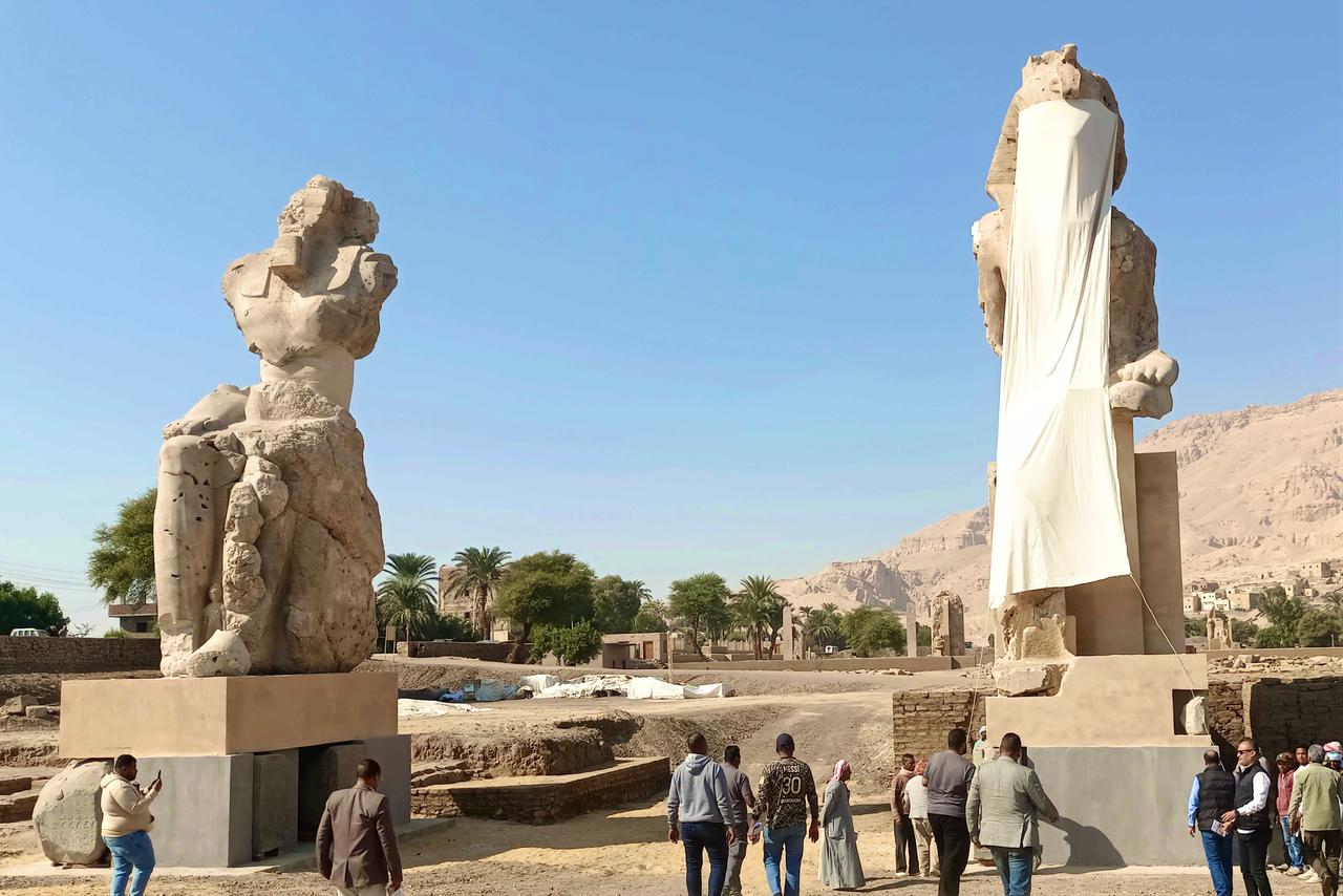 Statues of Pharaoh Amenhotep III, known as the Sun King, are placed at the Mortuary Temple within the Medinet Habu complex on the West Bank of Luxor during a ceremony in Luxor, Egypt, Dec. 14, 2025. (AA Photo)