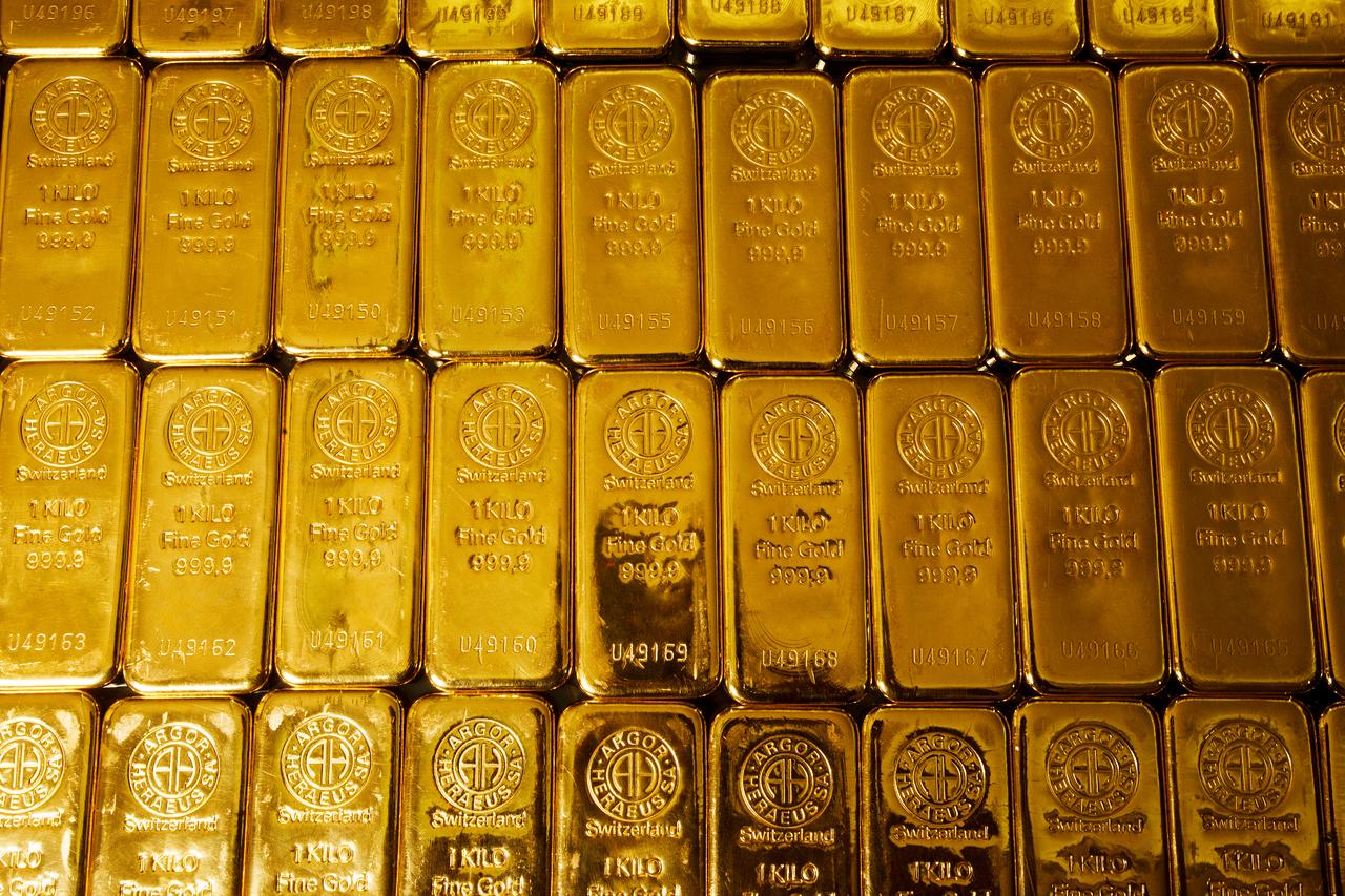 Gold nears record as Fed signals pause on rate cuts, silver extends rally