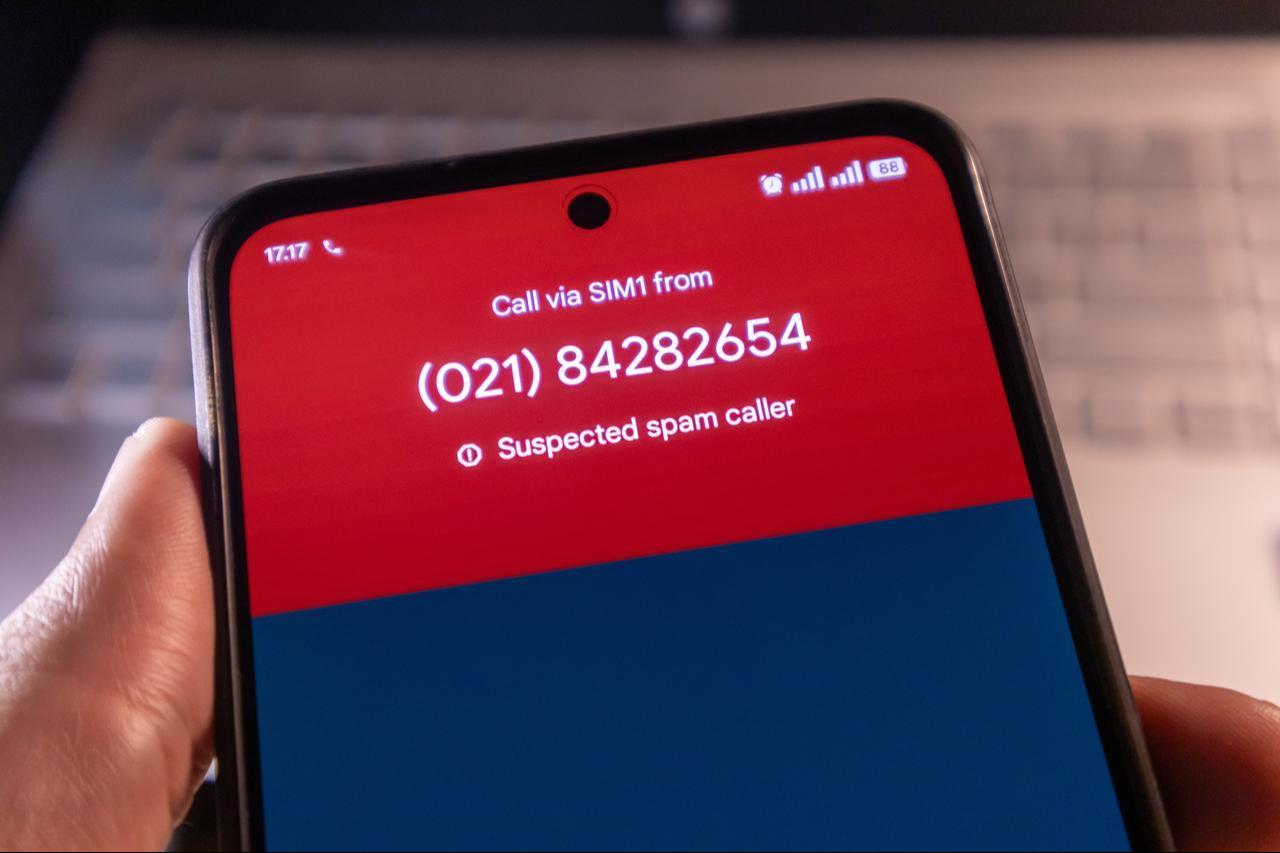 Hand holding a smartphone with a voice call suspected to be from spam in Jakarta, Indonesia - January 9, 2025. (Adobe Stock Photo)