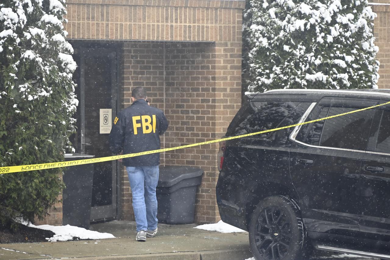 Person of interest to be released in Brown University shooting as manhunt resumes