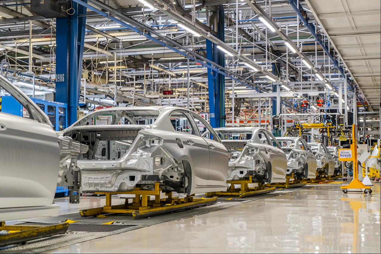 Unfinished vehicle bodies move along an assembly line at the Tofas plant in Bursa, Türkiye. (AA Photo)